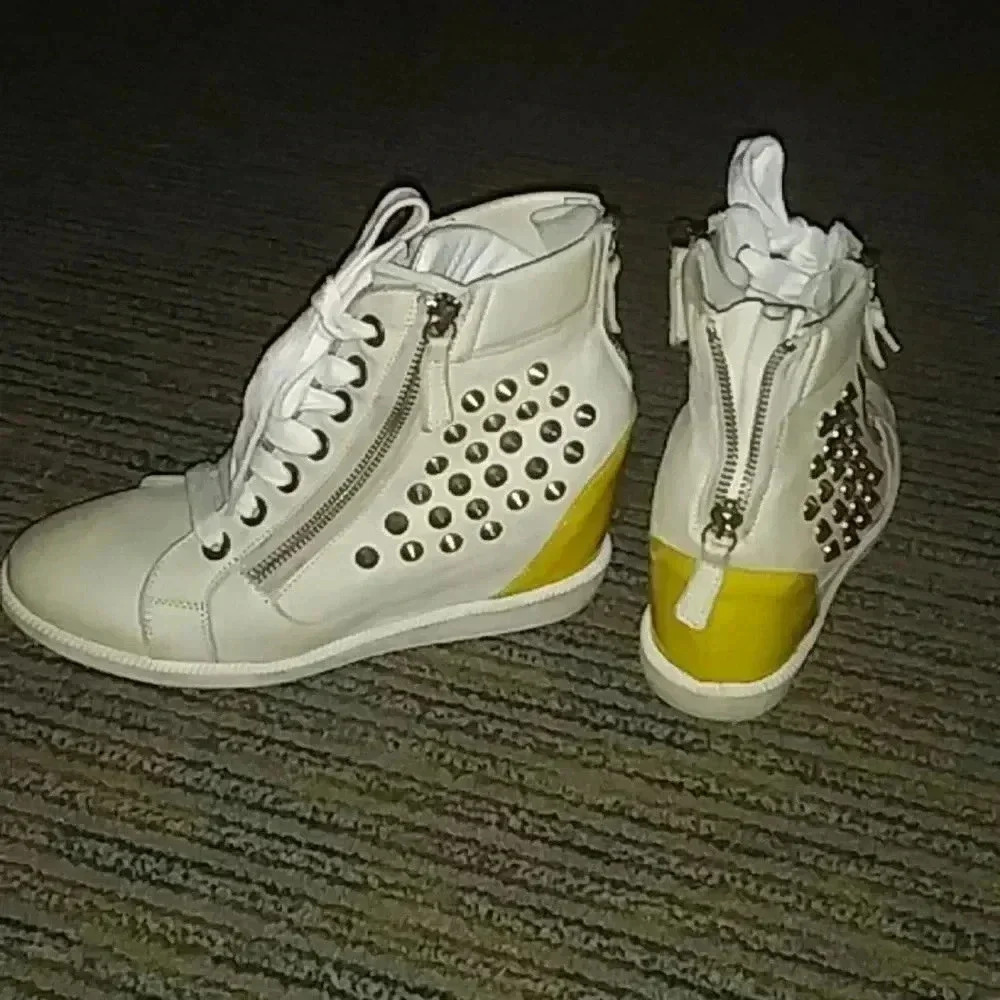 white and yellow boots with zippers